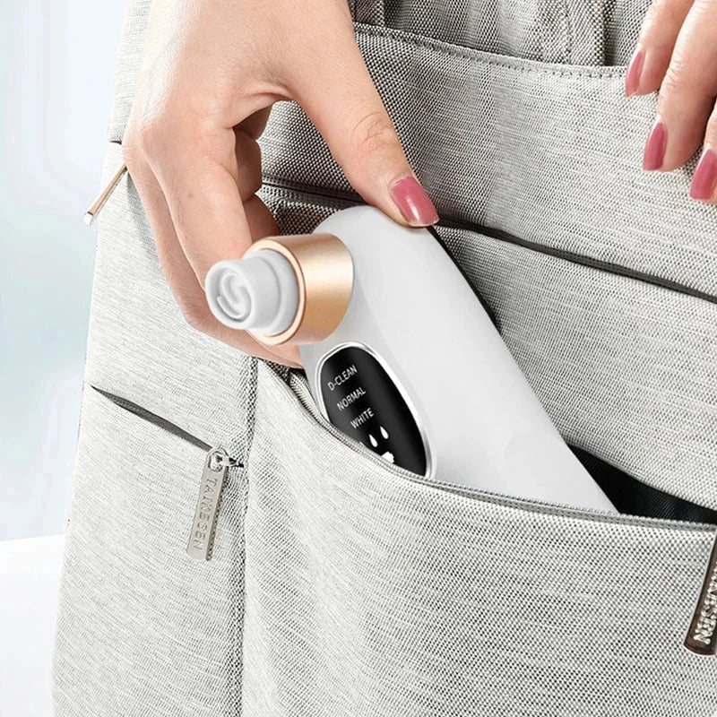 Beauty Device - A hand places a white oral irrigator with a rose gold accent into a light gray fabric bag pocket.