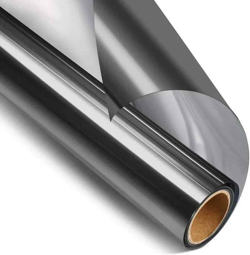 Window Film - Roll of dark silver glossy window tint film with a section lifted off the roll