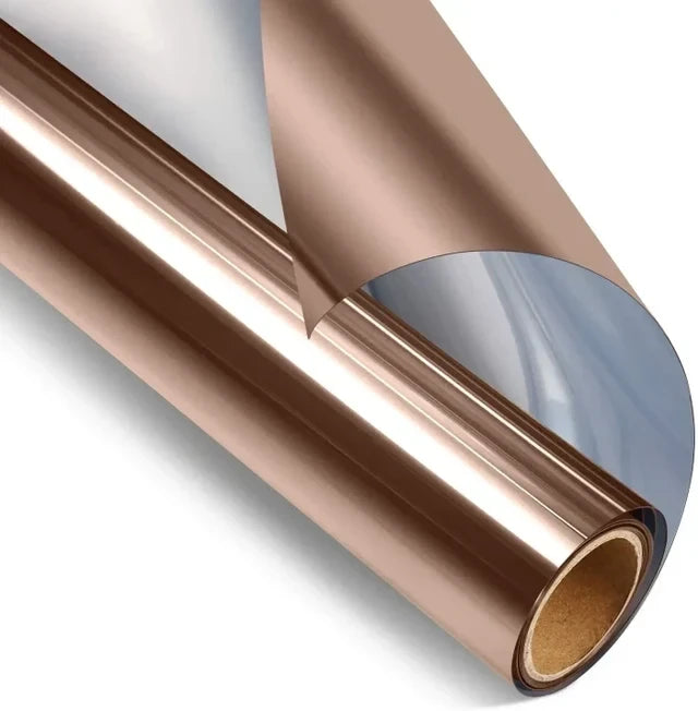 Roll of bronze glossy reflective window film with a section lifted from the roll