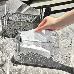Tissue Box Holder - Two clear textured tissue boxes with rabbit figurines, one in front with a hand pulling out a white tissue