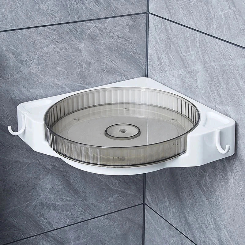 Wall-mounted rotating corner storage shelf installed on gray tiled bathroom wall