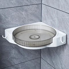 Wall-mounted rotating corner storage shelf installed on gray tiled bathroom wall