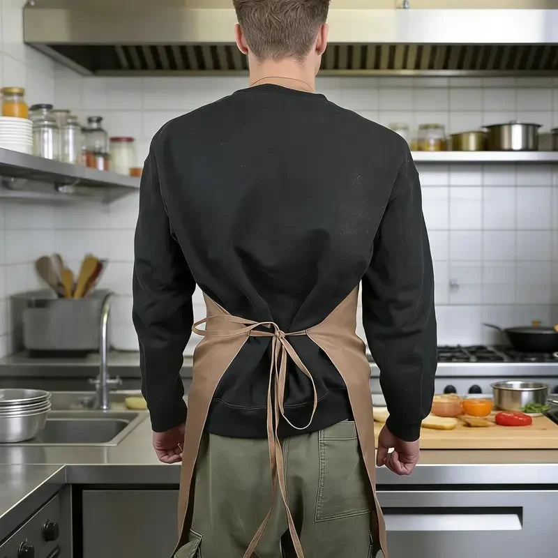 Man wearing brown funny gag chef apron from the back in a kitchen, showing tied waist straps