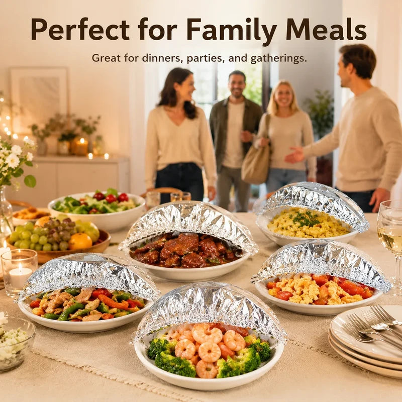 Table set with multiple bowls of prepared food, each topped with microwavable dish covers, at a family meal gathering.