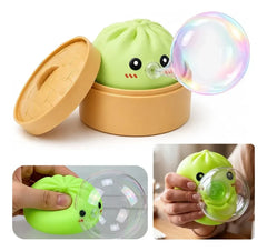 Sensory Bubble - Green cartoon steamed bun squeeze toy with bamboo steamer container, shown blowing a bubble in two squeeze views.