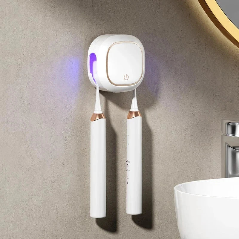 Uv Toothbrush Sanitizer Holder - Wall-mounted white UV toothbrush sanitizer holding two white electric toothbrushes on a textured wall