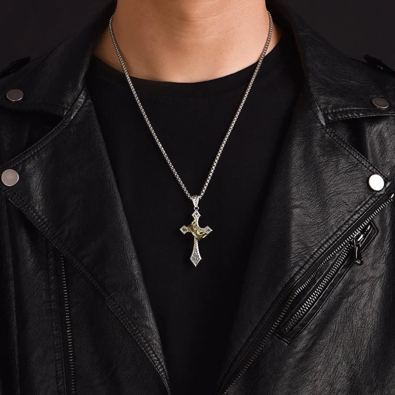 Crown Pendant - Silver-tone necklace with crown-accented cross worn over black t-shirt and black leather jacket