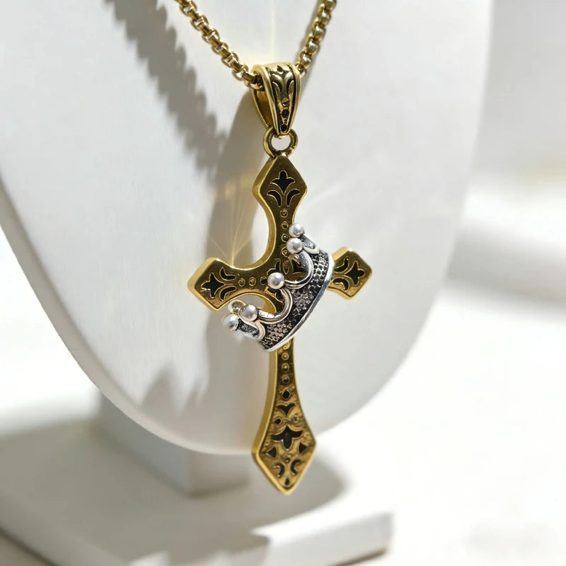 Crown Pendant - Gold-tone cross design with silver crown accent displayed on white necklace bust, attached to gold box chain