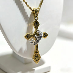 Crown Pendant - Gold-tone cross design with silver crown accent displayed on white necklace bust, attached to gold box chain