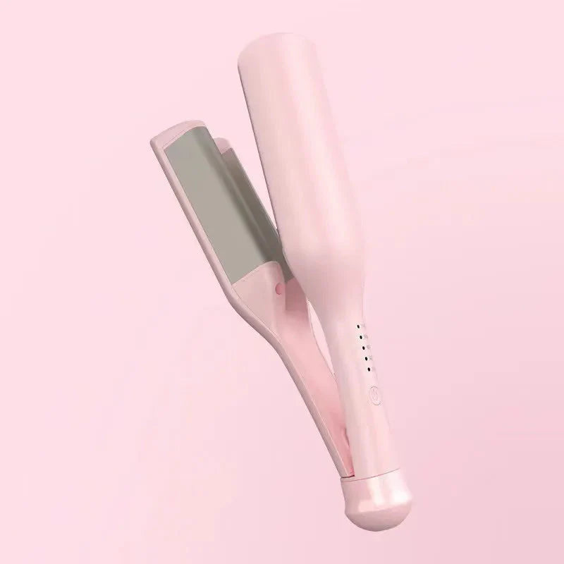 Hand holding the mermaid hair waver near styled beach waves