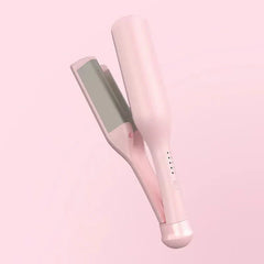 Hand holding the mermaid hair waver near styled beach waves