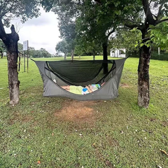 Lay-flat waterproof hammock , featuring insect netting and a rain fly.