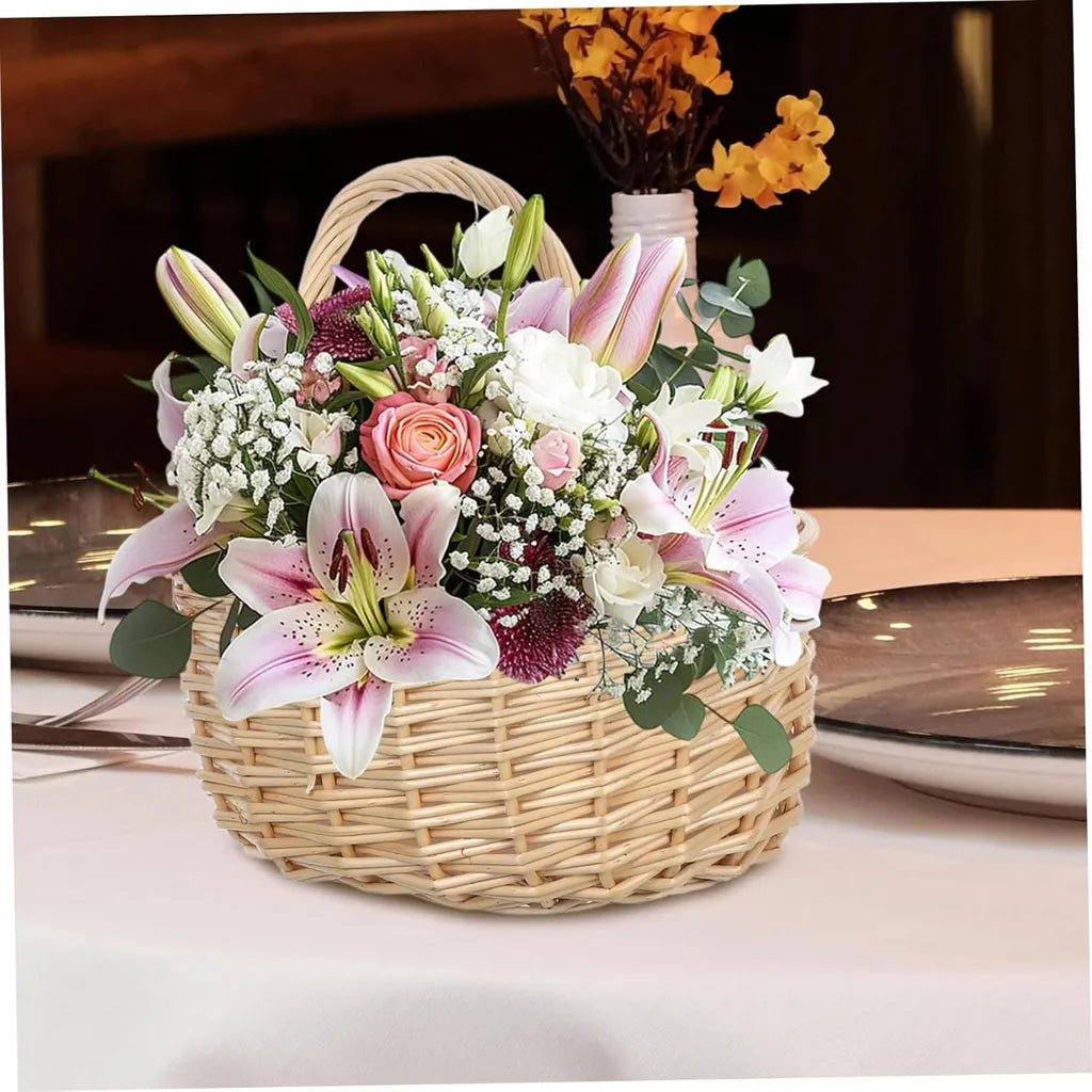 Wicker flower basket filled with lilies, roses, baby's breath, and eucalyptus on dining table