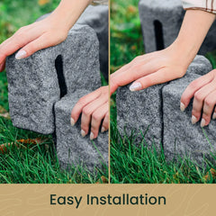 Close-up of hands connecting interlocking grey stone landscape edging pieces