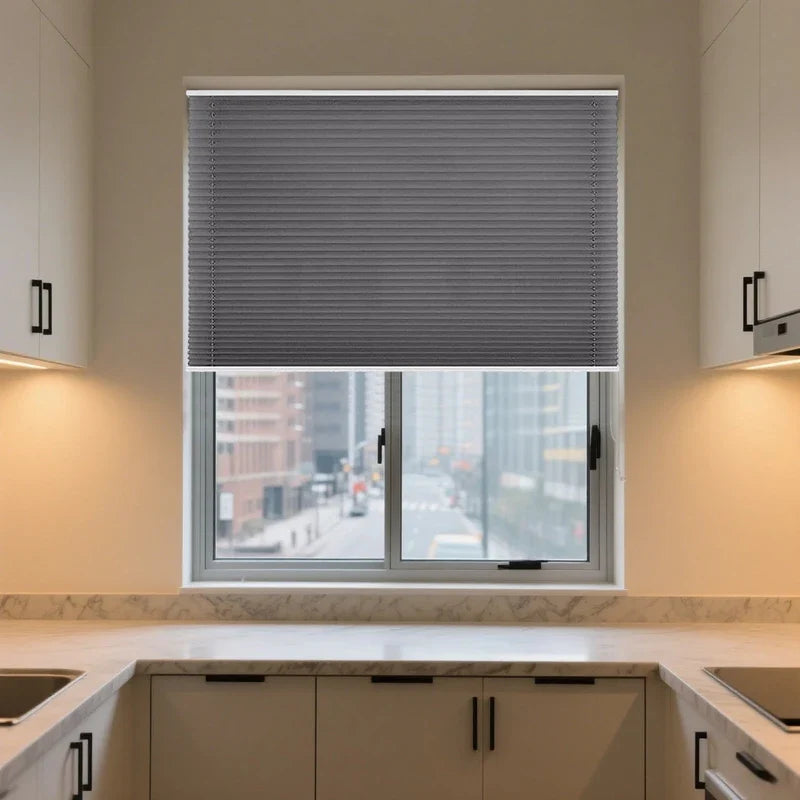 Grey thermal insulated blackout honeycomb blinds installed on modern kitchen window
