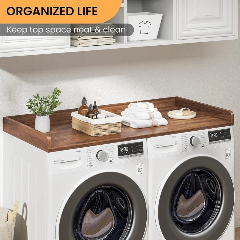 Wood washer dryer countertop on white laundry set with neatly placed towels and toiletries